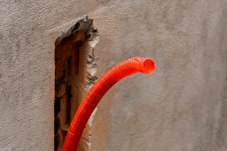 保温管建筑混凝土房屋墙壁修理用塑料塑料PVC管道隔绝材料水泥电缆绝缘安装石膏管子软管房子自来水浴室背景