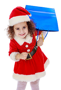 穿着圣诞老人装扮的小女孩 带着色彩多彩的包裹童年季节微笑盒子乐趣展示庆典婴儿假期孩子装饰高清图片素材
