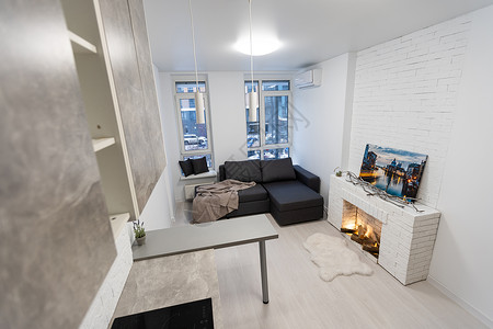常租公寓拥有开放的厨房和客厅的当代公寓地面木头窗帘建筑学软垫台面枕头烤箱装饰椅子背景