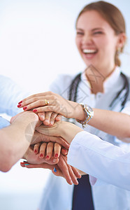 医生和护士在医疗团队中搭配双手药品女性精神圆圈医师团体合作脖子成年人微笑联盟高清图片素材
