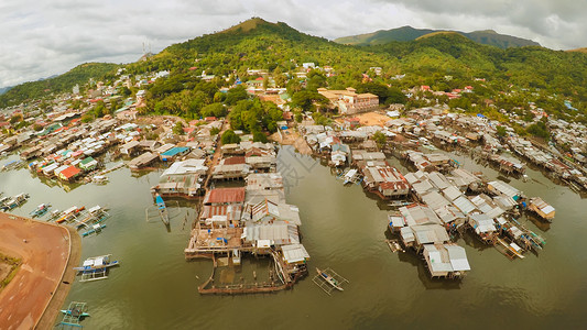 印度贫民窟海滩上的菲律宾贫民窟 城市的贫困地区 菲律宾波拉旺市穷城房屋邻里睡眠穷人数字小屋嘉年华饥饿状况背景