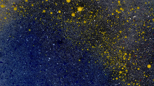 黑色薄雾蓝色空间背景的黄泡泡粒子艺术辉光树脂假期技术大理石灰尘金子墨水背景