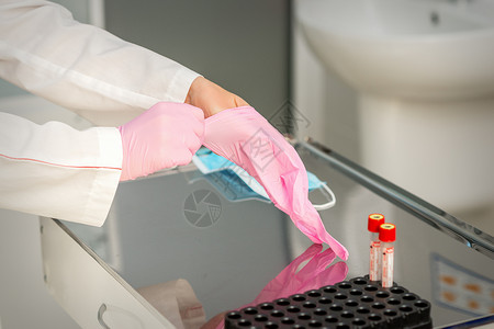 丁腈手套佩戴橡胶防护手套的医生腈类考试橡皮护士科学家手术手指控制测试工作背景
