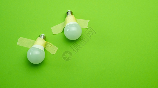 带带胶带的灯泡力量磁带技术科学头脑绿色灯丝概念教育艺术图片