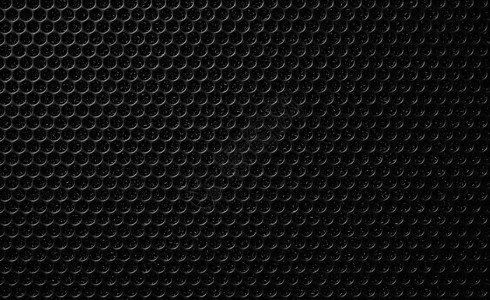 音响网格音乐扬声器上的安全网 保护网格音频扬声器 黑色安全网的近景 金属穿孔网 抽象图案 抽象黑色背景 专业音响设备金属圆圈力量材料体积背景