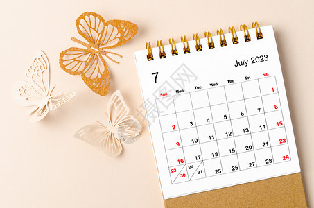 七月月签一份2023年7月的案头日历 供组织者规划和提醒黄底蝴蝶和蝴蝶背景