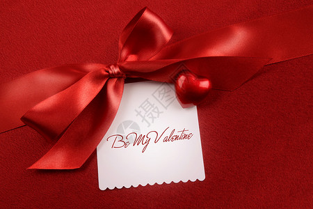 红上礼礼的晚礼弓和白卡 心脏假期 展示 约会 礼物 红色的背景图片