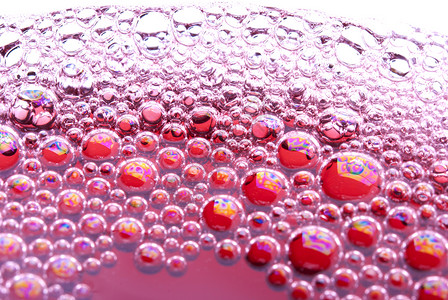 红色泡泡玻璃中带葡萄酒的泡泡 红色的 营养师 泡沫 气泡背景