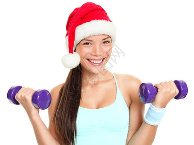 戴圣塔帽的圣诞健身妇女背景图片