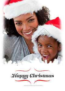 母亲和孩子海报母亲和女儿在圣诞节时玩得开心的复合形象 帽子背景