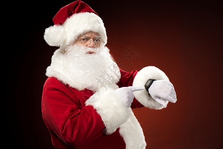 圣诞老人指着智慧观察 季节 快活的 快乐的 圣诞老人胡子 打手势背景图片