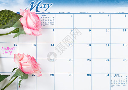 日历上贴有粉红玫瑰的节假日日背景图片