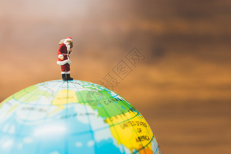 圣诞老人环绕着地球奔波 Y H 玩具 微型背景图片