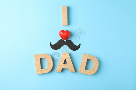 我爱胡子我爱爸爸的题词 用木字和红色装饰心和装饰性胡须在彩色背景空间上为 tex背景