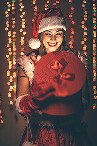 里面有什么东西? 可爱的 红色的 礼物 微笑 圣诞帽背景图片