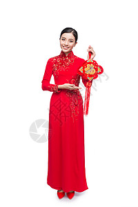 一位美丽的亚洲妇女穿着传统节服Ao Dai Tet节日 月亮新年 全文指幸运和幸福 奥黛背景图片