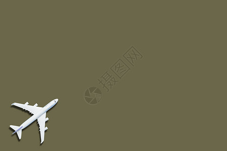 机型飞机 用绿色彩色背景的飞机 玩具 纸 插图背景图片