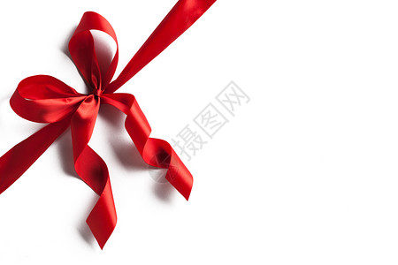 孤立在惠特上的红丝带蝴蝶结 庆典 框架 包装 展示背景图片
