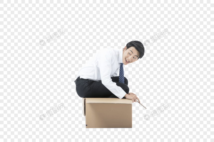 商务男性坐在纸箱里图片