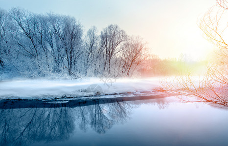 日落雪景冬季雾凇设计图片