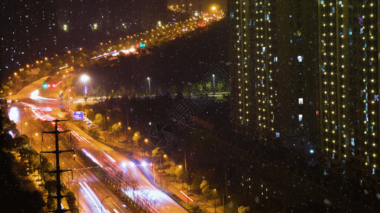 下雪夜景风雪城市夜景延时交通GIF高清图片