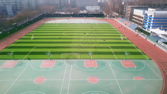 足球场足球运动西安工程大学体育场航拍GIF高清图片