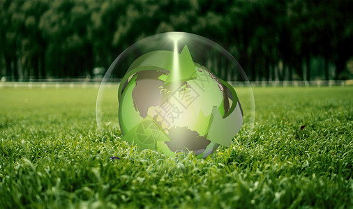 绿色环保建材草地上的地球设计图片