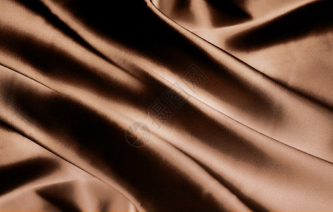 面料特写咖啡色丝绸背景设计图片