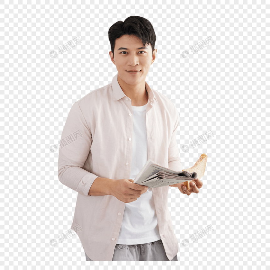 帅气的年轻男士在厨房读报纸图片