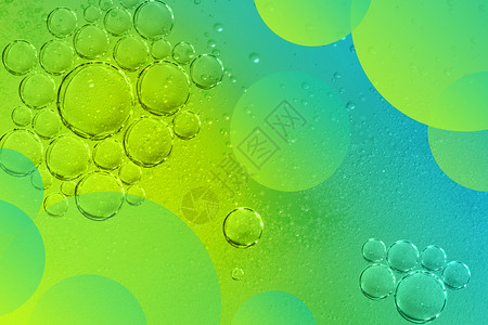 黄色圆形旋转波纹绿色水珠抽象水泡背景设计图片