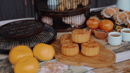 月饼茶中秋节桔子月饼和柿子GIF高清图片