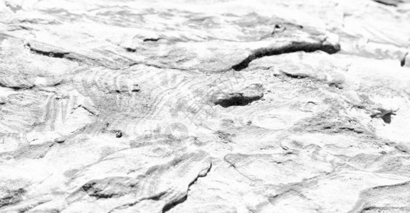 岩石在固体和表面质和空间概念中的抽象背景纹理图片
