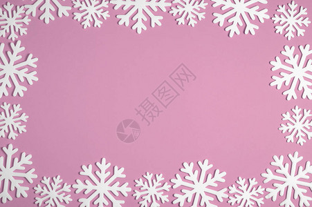 粉红色背景上的圣诞雪花边框Xmas最小纹理背景图片