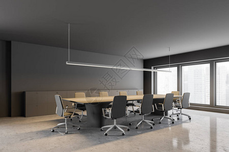 办公室会议室的角落有灰色墙壁石地板大窗户米色和灰色长桌和米色椅子图片