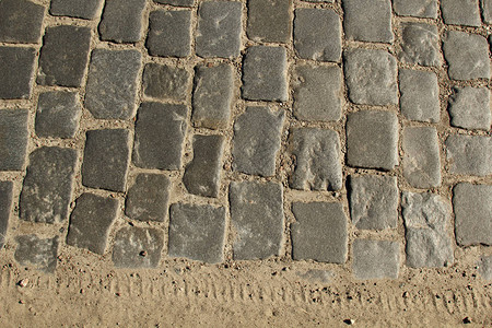 石路面纹理花岗岩鹅卵石路面背景旧鹅卵石路面特写的抽象背图片