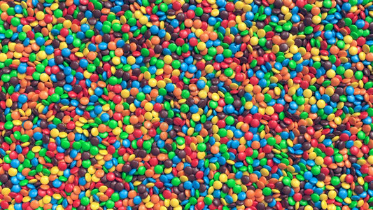 一大堆多彩的涂层巧克力糖盒图片