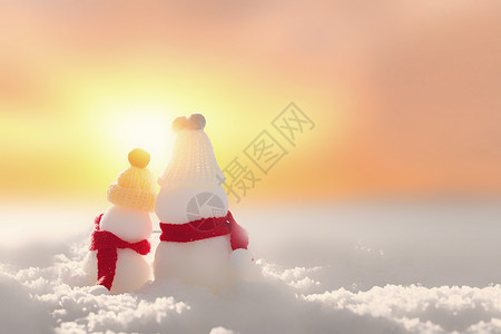 唯美日出雪人创意冬天背景设计图片