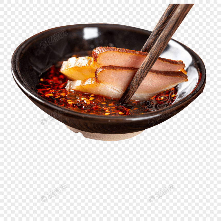 筷子将腊肉放入辣椒油中图片