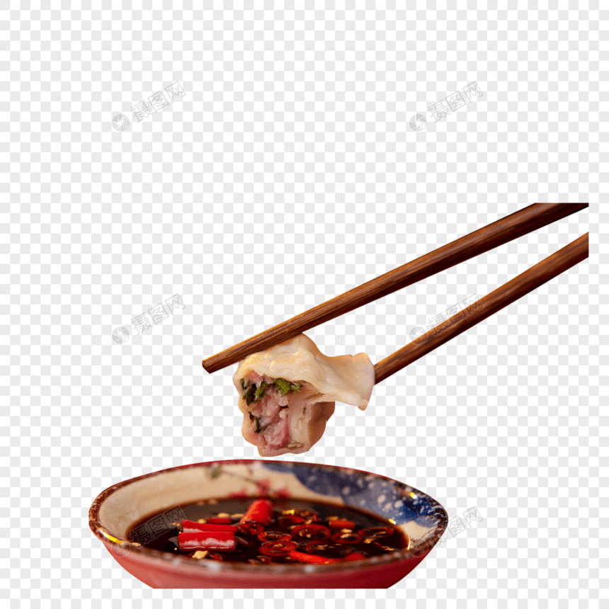 拿筷子夹饺子蘸酱油醋特写图片