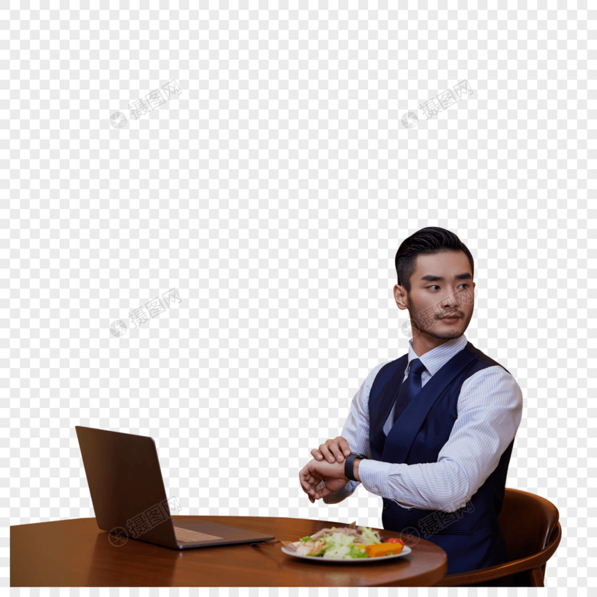 在餐桌上吃色拉的职场男士图片