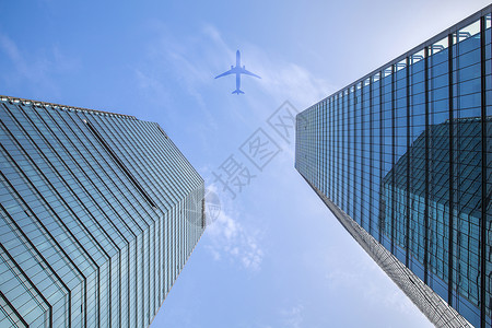 蓝色主视觉高楼大厦·梦想飞翔背景
