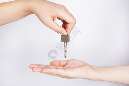 房屋买卖双手交递钥匙背景