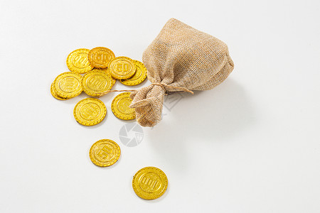 数字贸易袋子旁散落的金币背景