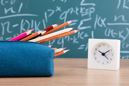 蓝色教育画册教育铅笔时钟黑板创意拍摄背景
