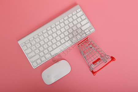 创意超市红色购物车键盘鼠标组合背景