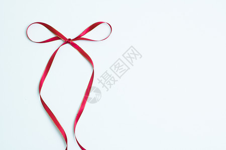 小清新蝴蝶结红色缎带的造型背景