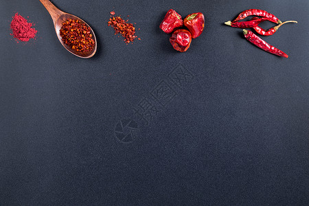 调料勺辣椒黑色底设计素材背景