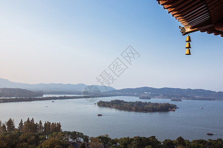 屋檐风铃杭州西湖龙头屋檐湖中岛背景