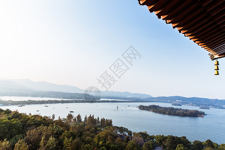 屋檐风铃杭州西湖龙头屋檐湖中岛背景