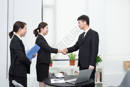 商务合作握手背景图片